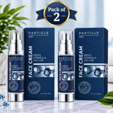 Two bottles of PARTICLE Face Cream Men's Formula Daily Care with their matching dark blue boxes, displayed on a marble surface with decorative green leaves and a 'Pack of 2' banner overlay.