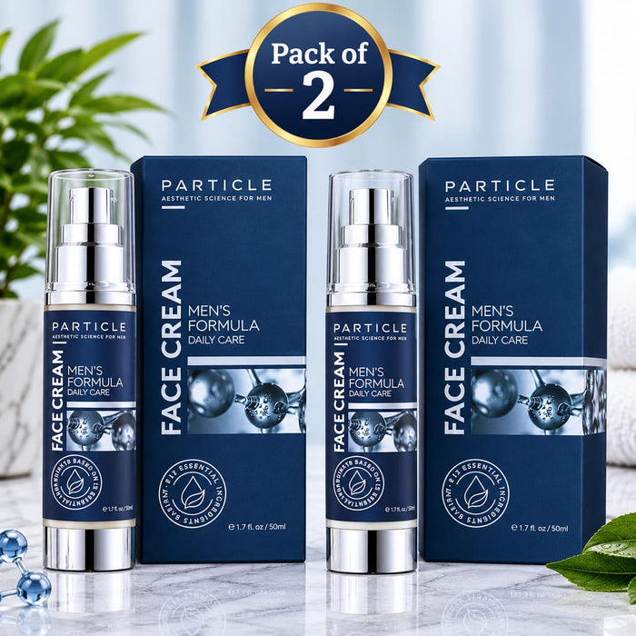 Two bottles of PARTICLE Face Cream Men's Formula Daily Care with their matching dark blue boxes, displayed on a marble surface with decorative green leaves and a 'Pack of 2' banner overlay.